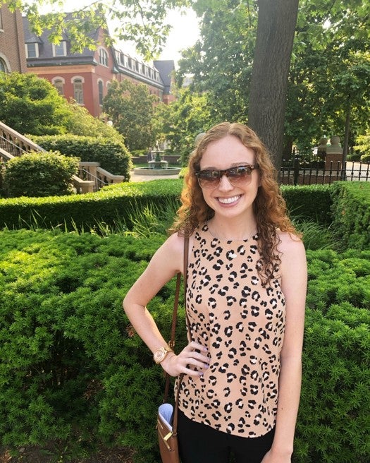 Student poses for photo on campus