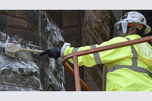 Worker cleans Altgeld Hall