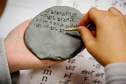 Cuneiform symbols on a clay tablet