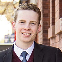 LAS student poses for photo in suit and tie