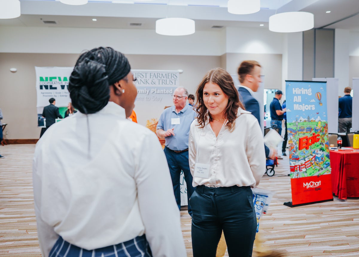 Student and a recruiter talking at the LAS career fair