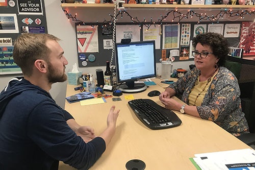 Jennifer Brandyberry, advisor for the School of Molecular and Cellular Biology, visits with a student during registration for the Spring 2020 semester. Photo courtesy of Jennifer Brandyberry