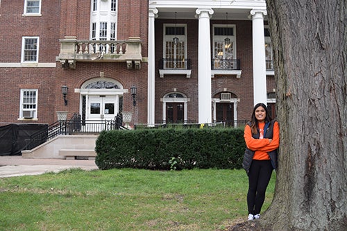 Megan Resurreccion poses in front of the English Building