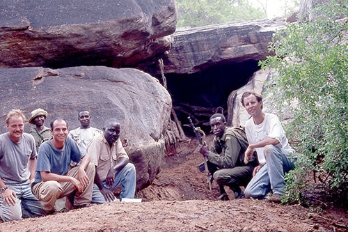 Team outside of cave where lions lived