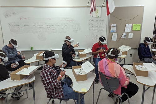 School kids with virtual reality headsets