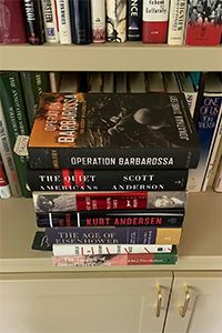 A pile of books on a shelf