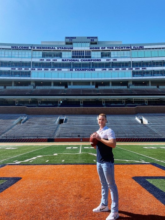 LAS student Nick Hafner stands at mid-field at Memorial Stadium