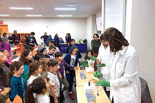 Children watching a laboratory experiment