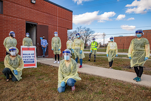 Volunteer clinicians in protective suits