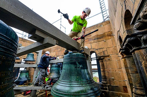 Worker removes a bell