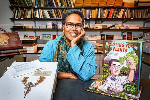 Janice Harrington displaying book