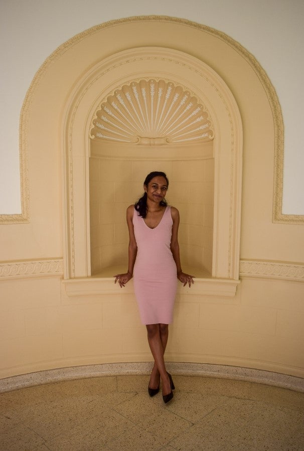 LAS student poses for photo in a pink dress