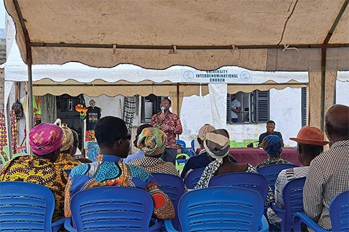 Lakisha David speaks in Elmina, Ghana, about her DNA project before collecting saliva samples.
