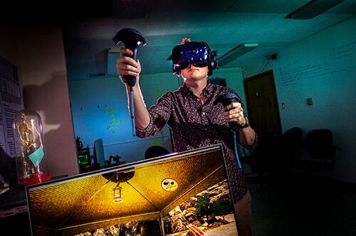 A grad student explores a virtual environment using VR
