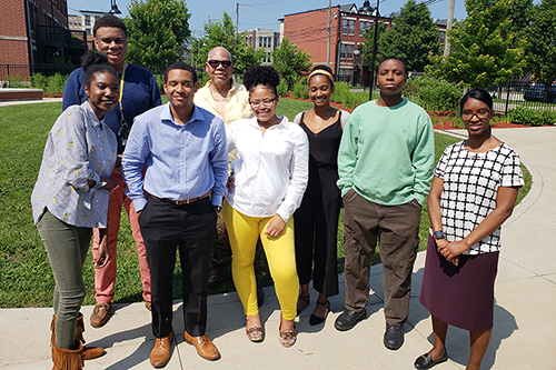 Students and professor with The Community Builders