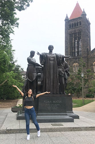 Daria Zelen poses by the Alma Mater