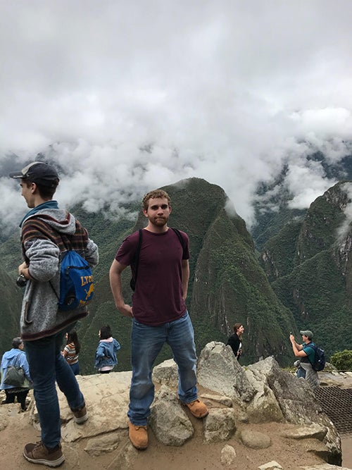 Caleb Fogler poses in Peru, where he studied abroad