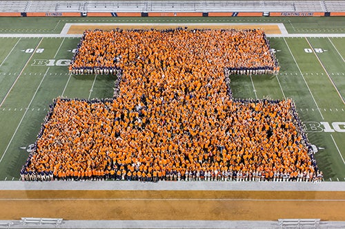 New students form an orange Block I at Memorial Stadium.