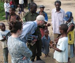 LAS professor Tom Gillespie (center) and a team of students visited Ugandan communities to search for the monkeypox virus. What they found has reshaped notions of how far the virus has spread.