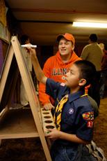 Students from professor Ann Abbott's Spanish classes connect with people of all ages from the local Latino community, including area boy scouts. (Photo by Thompson-McClellan.)