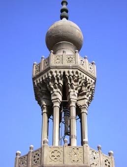 A student climbs to the top of a minaret.