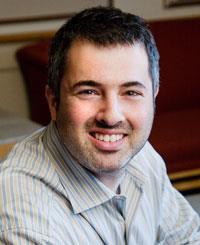 Economics professor Darren Lubotsky says older kindergartners fare better academically largely because they learn more before starting school, not because age improves aptitude. (Photo by L. Brian Stauffer.)