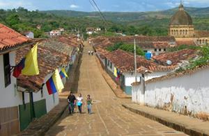 Flag-draped street in 18th-century town of Barichara, province of Norte de Santander, on the day President Uribe visted for a nationally televised town-hall meeting. (Photo courtesy of Nils Jacobsen)