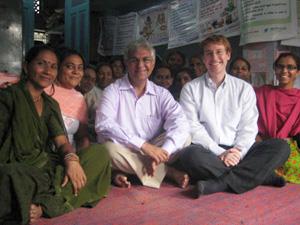 Michael Newbill (second from right) visits with a community health organization in Gujarat.