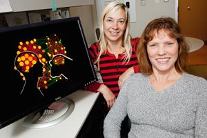 Cell and developmental biology professor Lisa Stubbs (right) and postdoctoral researcher Katja Nowick and their colleagues found distinct differences in gene activity between humans and chimps. These differences are associated with about 90 transcription factors, they found.