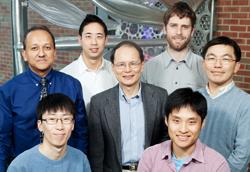 Researchers at Illinois have developed a 'microvascular stamp' that lays out a blueprint for new blood vessels and spurs their growth in predetermined pattern. The research team included (from left, standing) Rashid Bashir, a professor of electrical and computer engineering; graduate student Vincent Chan; K. Jimmy Hsia, a professor of mechanical science and engineering; graduate student Casey Dyck; and Hyunjoon Kong, a professor of chemical and biomolecular engineering; and (from left, seated) postdoctoral researcher Jae Hyun Jeong and graduate student Chaenyung Cha. (Photo by L. Brian Stauffer)