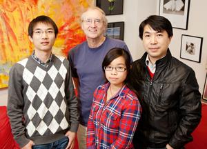 University of Illinois chemistry professor Eric Oldfield (second from left) and (from left) graduate assistant Wei Zhu, graduate student Xinxin Feng, and research scientist Yonghui Zhang found that a modified bone drug killed the malaria parasite in mice. (Photo by L. Brian Stauffer)