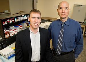 University of Illinois chemistry professor Paul Hergenrother, left, and veterinary clinical medicine professor Tim Fan led a study of an anti-cancer compound in pet dogs that is now headed for human clinical trials. (Photo by L. Brian Stauffer)