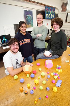Illinois Geometry Lab members: senior Brian Freidin, sophomore Ananya Uppal, graduate student outreach manager Noel DeJarnette, and senior Rob Halliday. (Photo by L. Brian Stauffer)