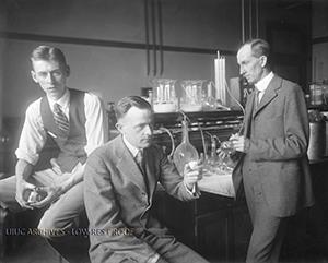 University graduate student in chemistry J. Allen Harris (presumed to be on the left) with professors of chemistry L. F. Yntema (presumed to be in the middle) and B. Smith Hopkins (presumed to be on the right) in a chemistry laboratory, circa 1924-26. (Image 0004272 courtesy of University Archives)