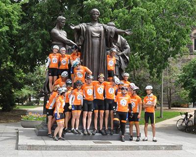 Illini 4000 members pose with the Alma Mater after they arrived in Champaign on Sunday, June 8.