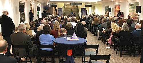 A crowd listened to new Greece Consul General Polyxeni Petropoulou during the College of LAS Alumni Association's gathering at the Field Museum's limited-time exhibition, The Greeks from Agamemnon to Alexander the Great.