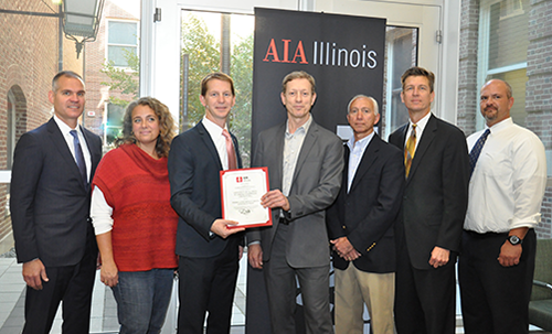 From left, Matthew Tomaszewski, U of I's associate provost for capital planning, Karla Smalley, architect with Bailey Edward, Mike Waldinger, executive vice president of AIA Illinois, Ron Harrison, associate vice president of CannonDesign, Kirk Fernandes, regional manager with Illinois Capital Development Board, Charles Smith, principal of CannonDesign, and Mike Wise, assistant director for parking at U of I, pose for a photo to accept the 2015 Citation of Merit in the Frank Lloyd Wright category from American Institute of Architecture Illinois.