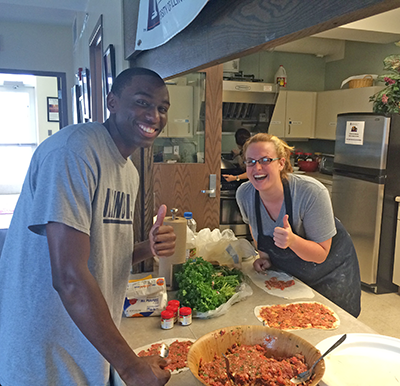 Participants in the 2015 University of Illinois Summer Institute for Languages of the Muslim World cook meals at the Asian American Cultural Center, as the institute also exposed people to aspects of culture other than language. (Photo courtesy of Eman Sadaah)