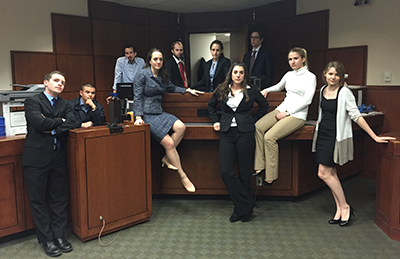The Trial Team's Orange team takes a moment to strike a pose in the courtroom at the Open-Round Championship Series in Louisville, Ky.