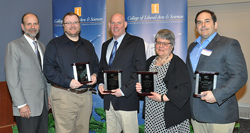 From left: Brian Ross, executive associate dean of the College of LAS, honors recipients of the Dean's Award for Excellence in Undergraduate Teaching, including professors Robert Barrett (English), David Rivier (cell and developmental biology), Mara Wade (Germanic languages and literatures), and Lee DeVille (mathematics).