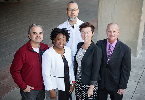 An interdisciplinary team found pronounced differences between police and laypersons' attitudes towards race. The team included, from left, Ripan Malhi, Carla Hunter, Patrick Vargas, Cris Hughes and Michael Schlosser. (Photo by L. Brian Stauffer)