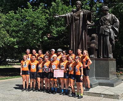 The Illini 4000 cross-country cycling group makes a stop at the Alma Mater in Champaign on June 16. The student-run, nonprofit foundation's members bike from New York City to San Francisco each summer to raise money for cancer research.