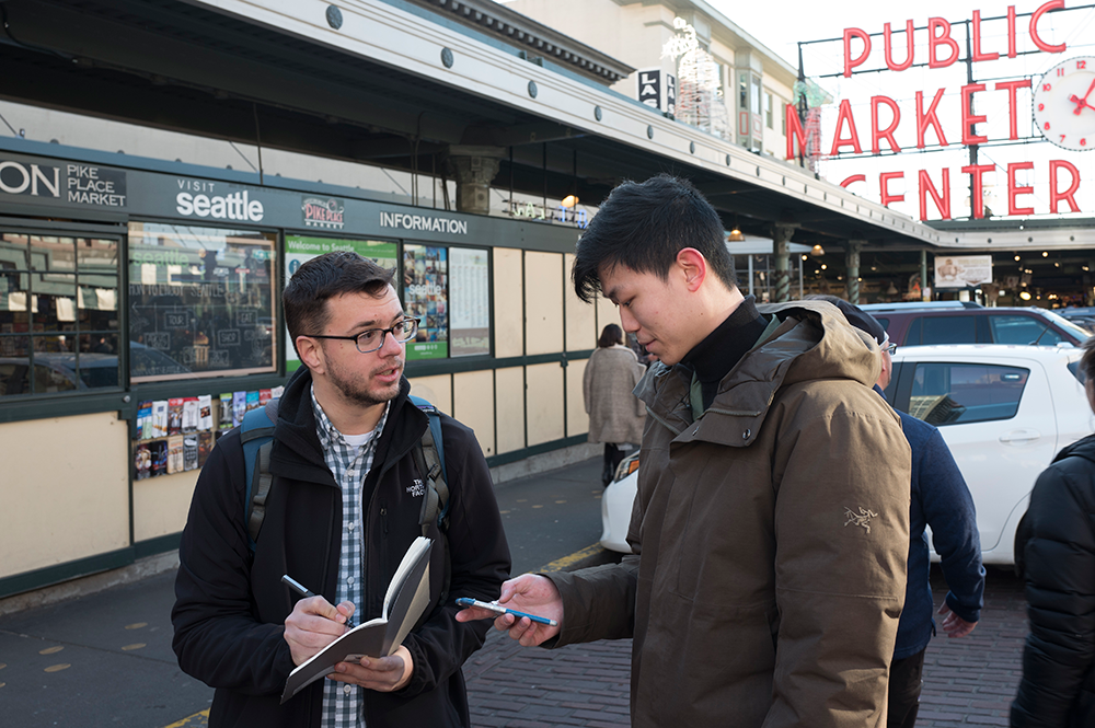 As an interaction designer at Expedia, Nixon (left) conducts usability studies with passersby in Seattle's Pike Place Market. (Photos courtesy of Chris Nixon.) 