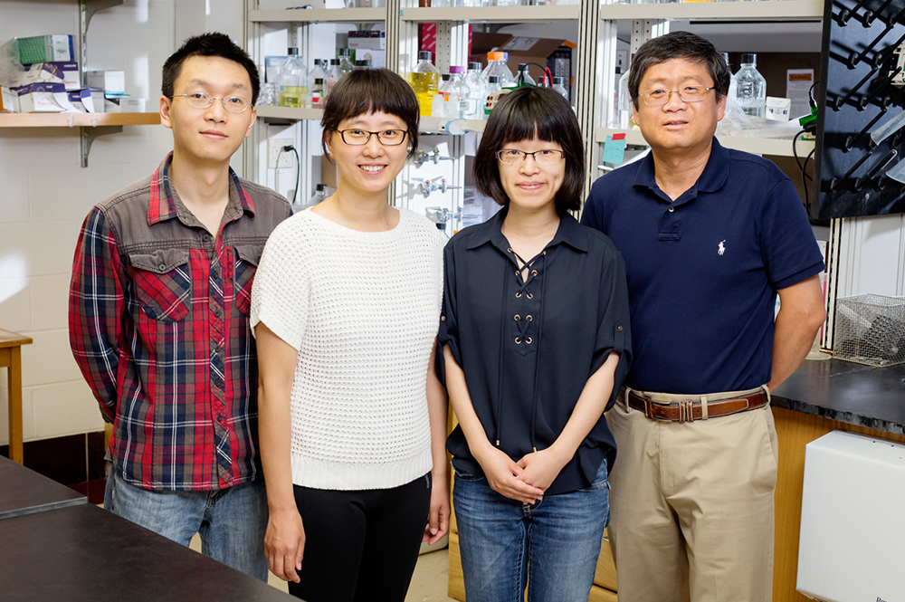 Biochemistry professor Lin-Feng Chen, right, with, from left, postdoctoral researchers Xiangming Hu, Yan Bao and Jinjing Chen, study proteins that regulate the inflammatory response.