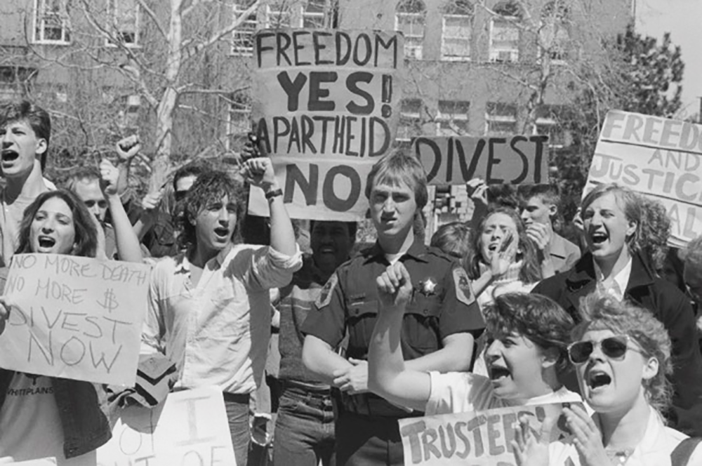 Jeff Christensen, center, stationed at a campus protest as a new police officer in 1986. (Reproduced by permission of The News-Gazette, Inc., 2017. Permission does not imply endorsement.) 
