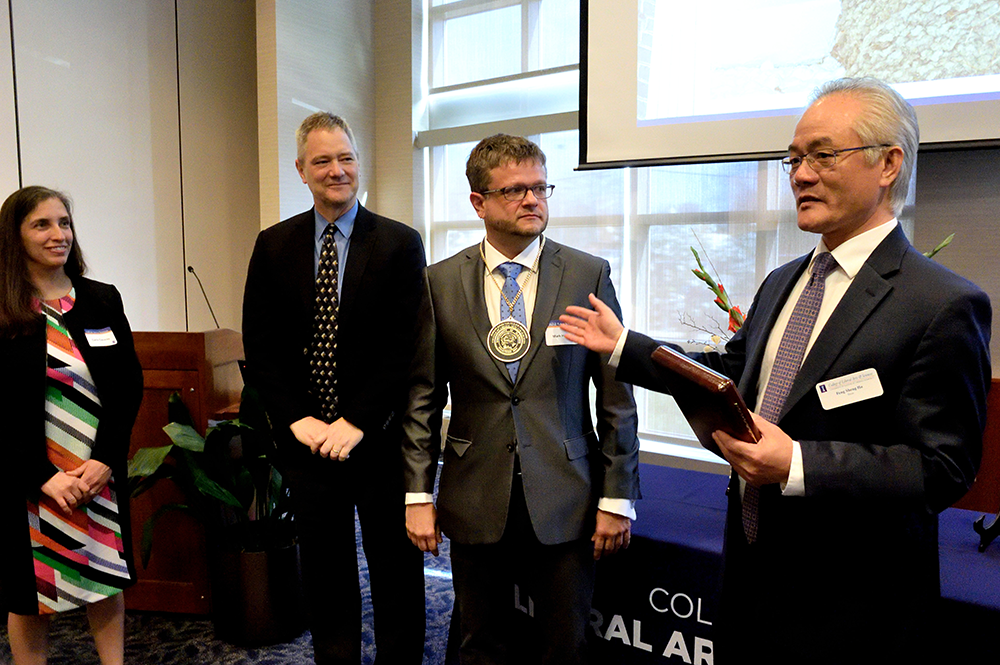 From left: Carla Cáceres, director of the School of Integrative Biology, Kevin Pitts, vice provost for undergraduate education at Illinois, Mark Hauber, and Feng Sheng Hu, Harry E. Preble Dean of the College of LAS, speak during Hauber’s investiture ceremony as the Harley Jones Van Cleave Professor. (Thompson-McClellan Photography.) 