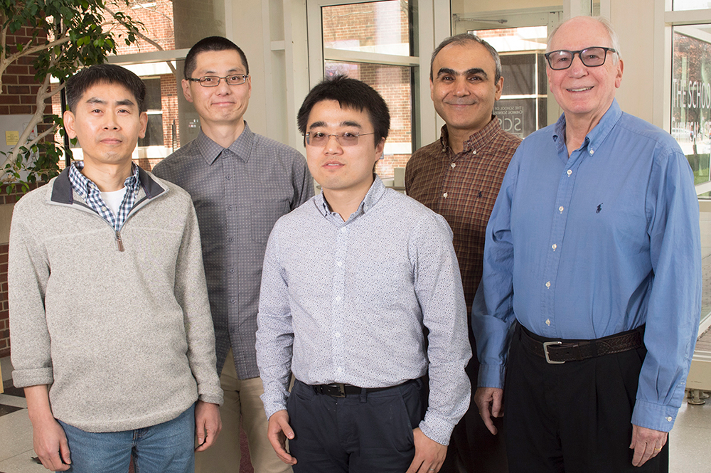Researchers, from left, Sangjin Hong, Yuhang Wang, Chang Sun, Emad Tajkhorshid and Robert Gennis determined the structure of a supercomplex of enzymes many bacteria use to generate energy. (Photo by Steph Adams.) 
