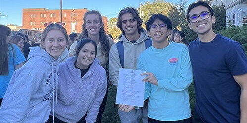 Members of Mi Pueblo outside La Casa Cultural Latina