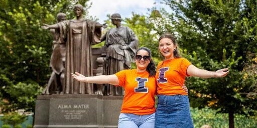 Students by the Alma Mater
