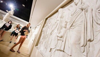 A student looks at artwork at Spurlock Museum